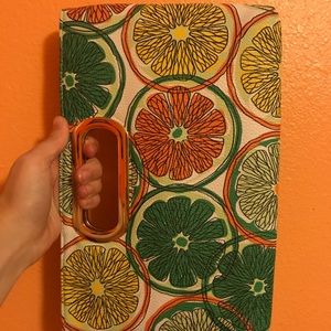 Summery fruit clutch with gold accent